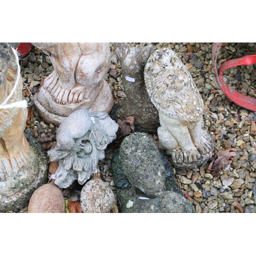 535 - Group of reconstituted stone garden ornaments in the form of animals to include lions, dogs, squirre... 