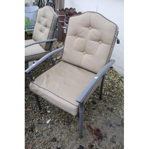 537 - Metal garden patio table with six chairs (featuring two sprung chairs), complete with cushions. (Tab... 