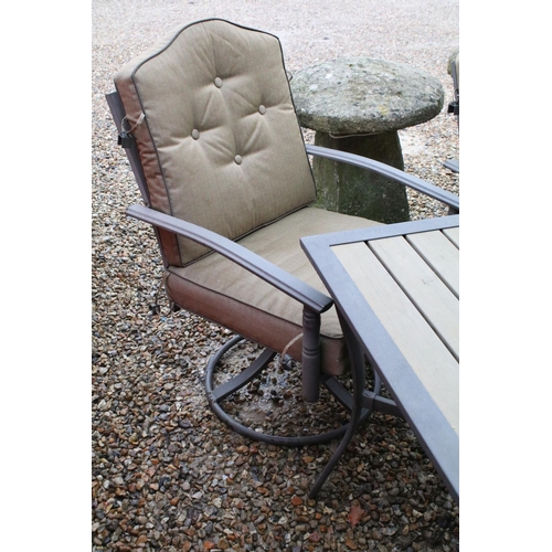 537 - Metal garden patio table with six chairs (featuring two sprung chairs), complete with cushions. (Tab... 