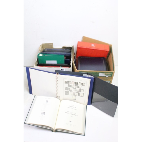 402 - A collection of empty stamp albums and stock books contained within two boxes.