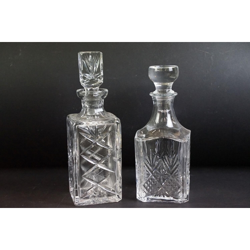 109 - Collection of twelve 20th century glass decanters of varying forms to include a ships decanters, hob... 