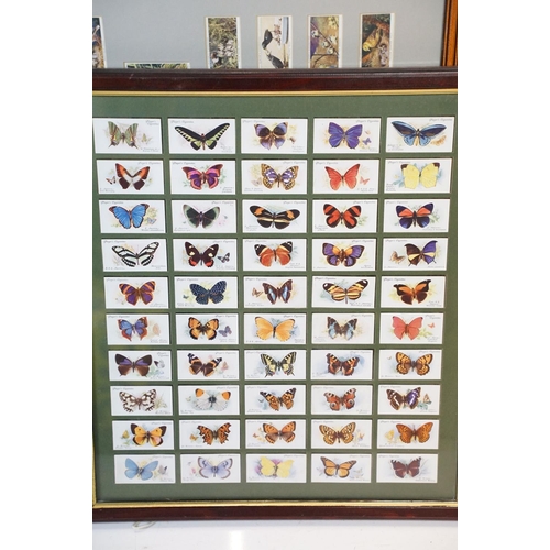 430 - A collection of seven framed and glazed set of cigarette cards together with two framed and glazed m... 