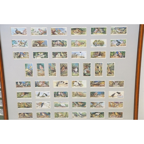 430 - A collection of seven framed and glazed set of cigarette cards together with two framed and glazed m... 