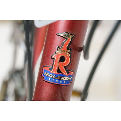 376 - Raleigh Bikes mountain bike, in metallic red, with Shimano gears, Selle Royal saddle, suspension, an... 