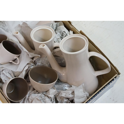 30 - Poole pottery twin tone sepia mushroom tea and dinner service. Two boxes.