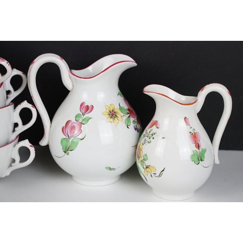 31 - French Luneville part tea service having floral printed details and pink rims. Printed black marks t... 