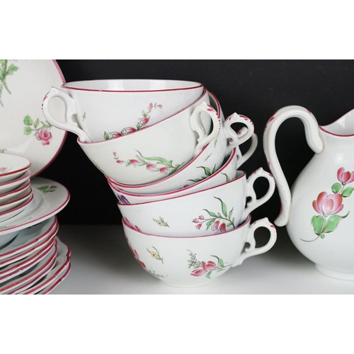 31 - French Luneville part tea service having floral printed details and pink rims. Printed black marks t... 