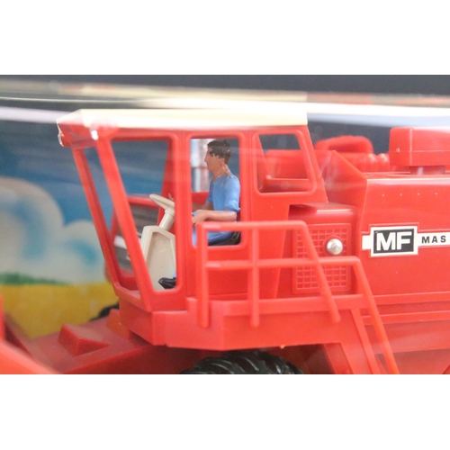 1086 - Boxed Britains 9570 Combine Harvester diecast model in excellent condition with outer slip box