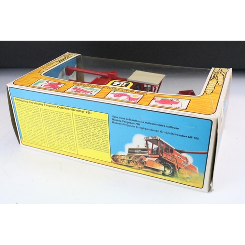 1086 - Boxed Britains 9570 Combine Harvester diecast model in excellent condition with outer slip box