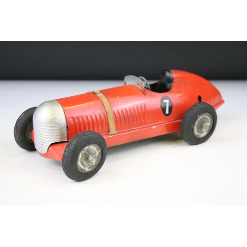 1334 - Tinplate Prestyn of England single seat number 7 racing car, comprising of red body with black seat,... 