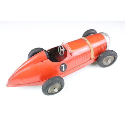 1334 - Tinplate Prestyn of England single seat number 7 racing car, comprising of red body with black seat,... 