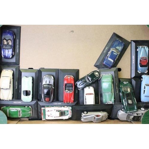 1031 - 25 Atlas Editons Jaguar diecast models, together with a quantity of associated empty boxes, plus a f... 