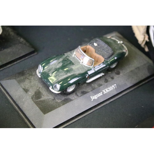 1031 - 25 Atlas Editons Jaguar diecast models, together with a quantity of associated empty boxes, plus a f... 