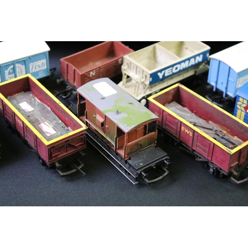 154 - Over 65 OO gauge items of rolling stock to include wagons, vans and tankers featuring Hornby and Tri... 