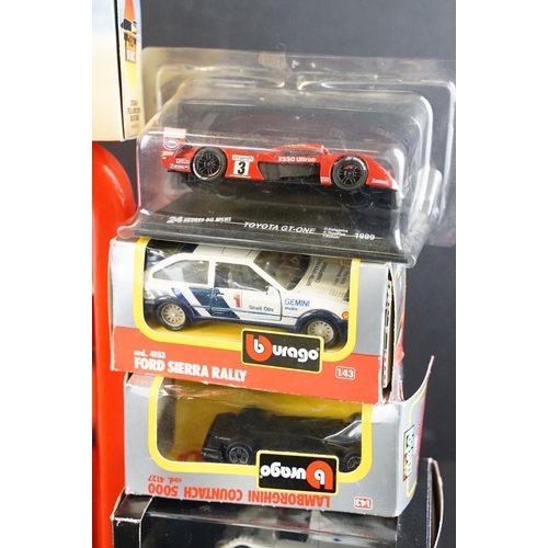 1160 - Collection of around 50 various boxed / cased diecast models to include Burago Ford Sierra Rally, So... 