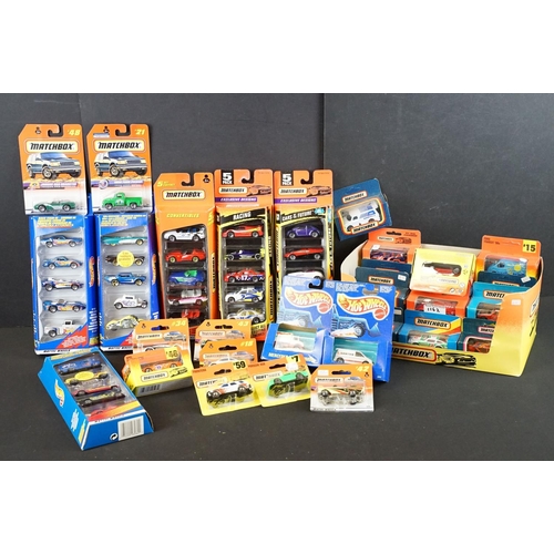 1162 - Around 40 boxed / carded Mattel Hot Wheels & Matchbox diecast models, circa 1980's / 90's, featuring... 