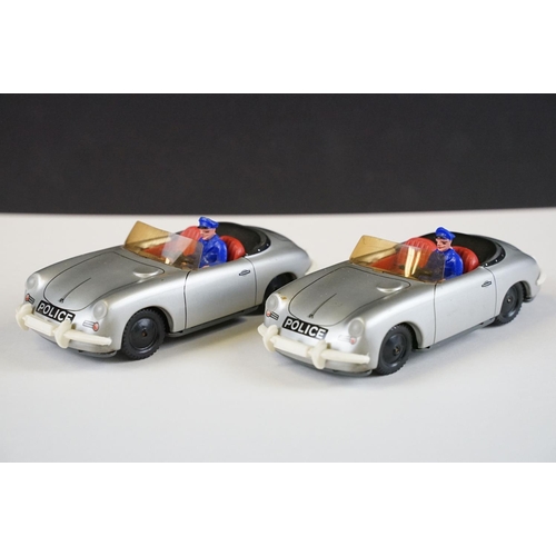 1280 - Two Tipp & Co West German tinplate Porsche Police car models, in silver, with windscreens & drivers.... 