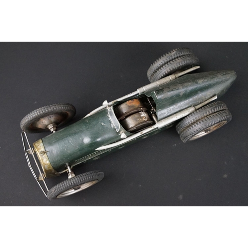 1393 - Early-to-mid 20th C scratch built model of a racing car, in dark green, with chain & cog wind-up mec... 