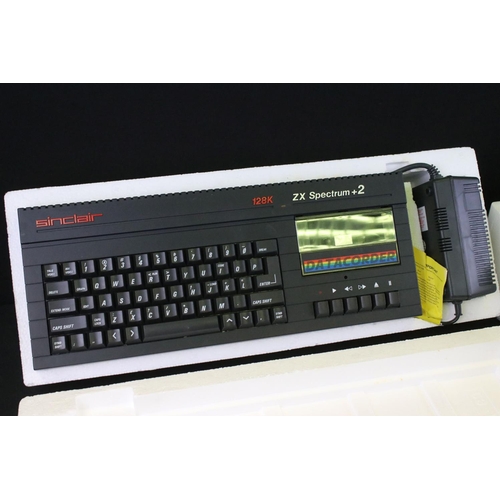 1472 - Retro Gaming - A boxed Sinclair ZX Spectrum +2 Action Pack, with computer, power supply, joystick, l... 