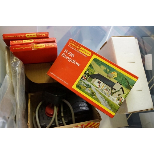 115 - Quantity of OO gauge model railway to include plastic trackside buildings, 28 x items of rolling sto... 
