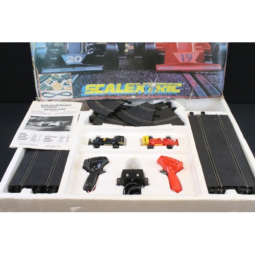 1493 - Three boxed Scalextric slot car racing sets to include G.P.3 Grand Prix Series, C.695 Pole Position ... 