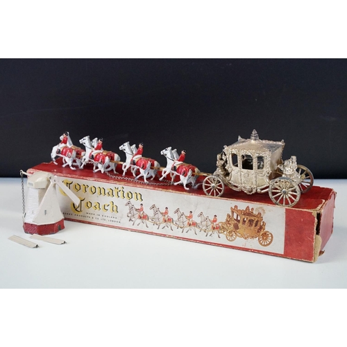 290 - Boxed Lesney Coronation Coach diecast model  (paint wear and tatty box) and a John Hill windmill wit... 