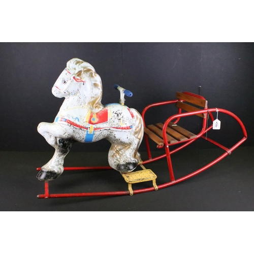 285A - Childs metal toy rocking horse with wooden slatted seat and red metal tube structure