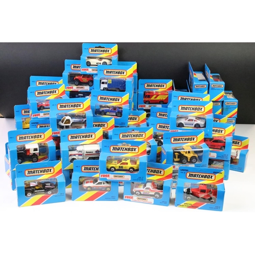 1346 - 82 Boxed Matchbox diecast models in blue boxes with 'red/yellow stripe', all appearing unopened