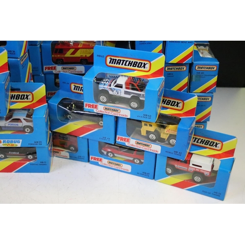 1346 - 82 Boxed Matchbox diecast models in blue boxes with 'red/yellow stripe', all appearing unopened