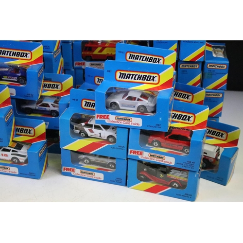 1346 - 82 Boxed Matchbox diecast models in blue boxes with 'red/yellow stripe', all appearing unopened