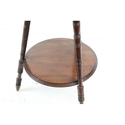 566 - Early 20th century Mahogany Circular Wine or Lamp Table raised on three turned ringed legs united by... 