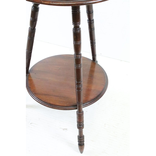 566 - Early 20th century Mahogany Circular Wine or Lamp Table raised on three turned ringed legs united by... 