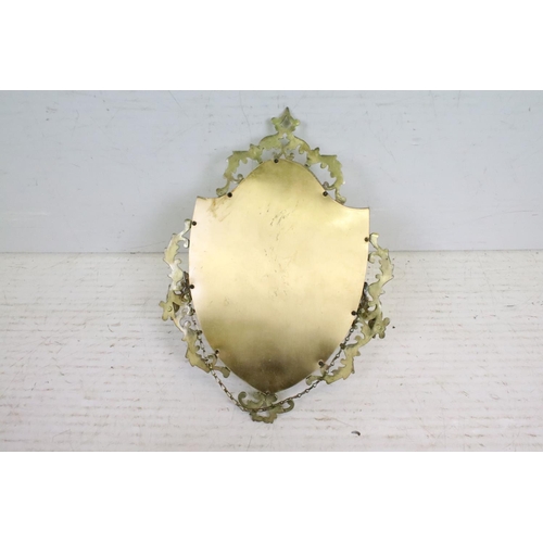 569 - Brass Shield Shaped Girandole Wall Mirror with pierced foliate scroll frame and bevelled edge, 28cm ... 