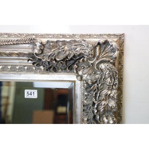 541 - Large Contemporary Mirror with silvered foliage moulded frame and bevelled edge, 176cm x 90cm