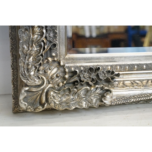 541 - Large Contemporary Mirror with silvered foliage moulded frame and bevelled edge, 176cm x 90cm