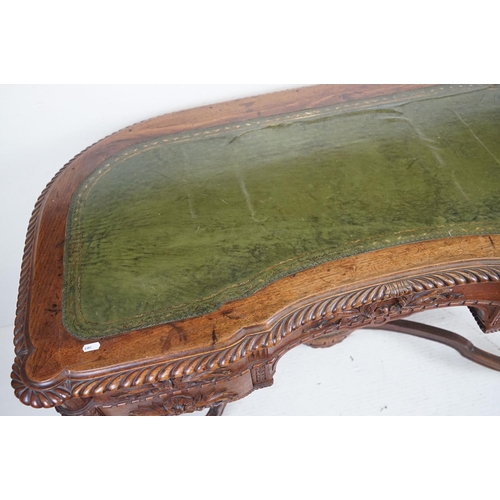 555 - 19th century Mahogany Desk of kidney outline, green leather inset top with fluted carved edge, the f... 