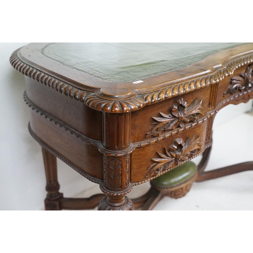 555 - 19th century Mahogany Desk of kidney outline, green leather inset top with fluted carved edge, the f... 