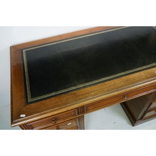 560 - 19th century style Mahogany Twin Pedestal Desk with black leather inset top and an arrangement of ni... 