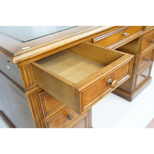 560 - 19th century style Mahogany Twin Pedestal Desk with black leather inset top and an arrangement of ni... 