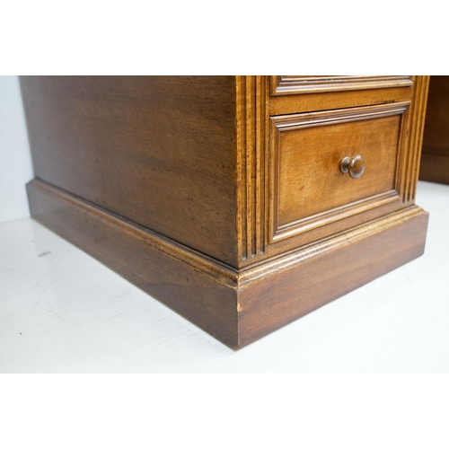 560 - 19th century style Mahogany Twin Pedestal Desk with black leather inset top and an arrangement of ni... 