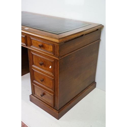 560 - 19th century style Mahogany Twin Pedestal Desk with black leather inset top and an arrangement of ni... 