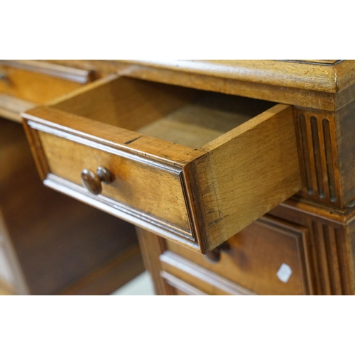 560 - 19th century style Mahogany Twin Pedestal Desk with black leather inset top and an arrangement of ni... 