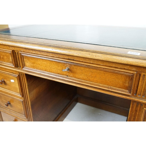 560 - 19th century style Mahogany Twin Pedestal Desk with black leather inset top and an arrangement of ni... 