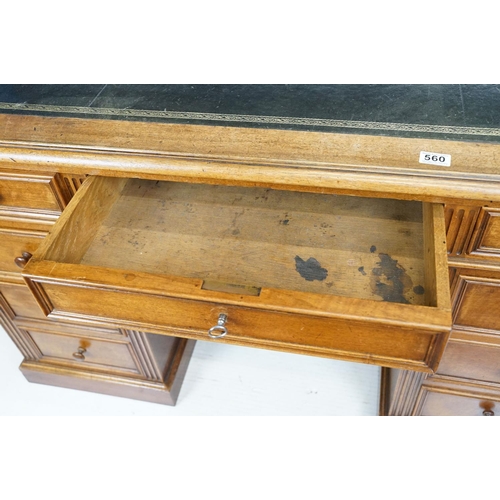 560 - 19th century style Mahogany Twin Pedestal Desk with black leather inset top and an arrangement of ni... 