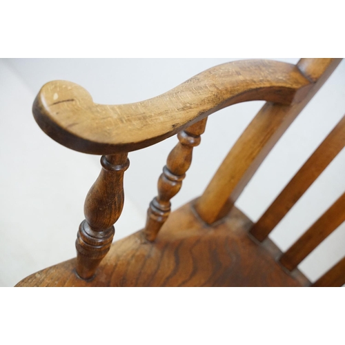 568 - 19th century Elm Seated Lathe Back Windsor Elbow Chair, 65cm wide x 107cm high