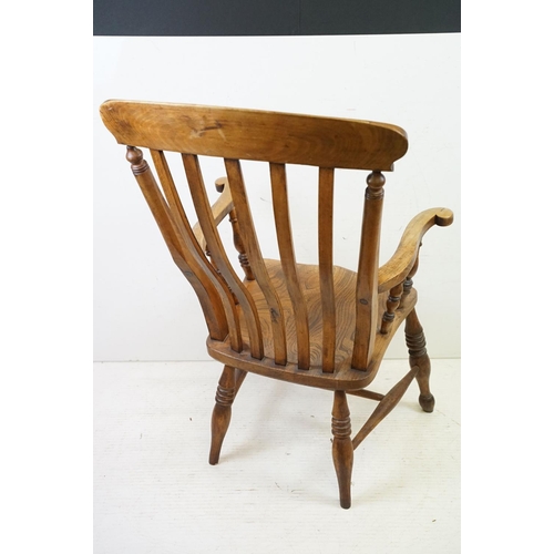 568 - 19th century Elm Seated Lathe Back Windsor Elbow Chair, 65cm wide x 107cm high