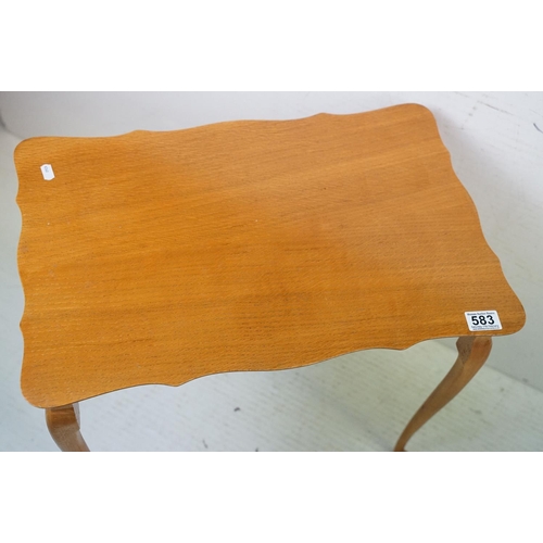 583 - Nest of Three Teak Table with shaped tops and cabriole legs, largest 56cm wide x 54cm high