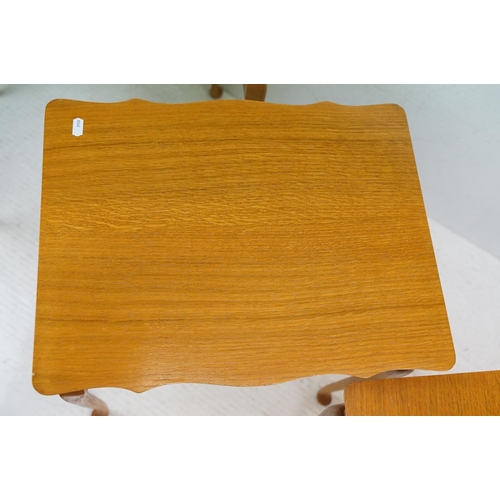 583 - Nest of Three Teak Table with shaped tops and cabriole legs, largest 56cm wide x 54cm high