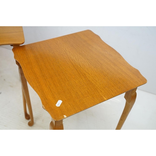 583 - Nest of Three Teak Table with shaped tops and cabriole legs, largest 56cm wide x 54cm high