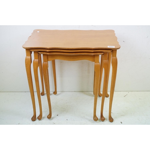 583 - Nest of Three Teak Table with shaped tops and cabriole legs, largest 56cm wide x 54cm high